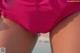 A close up of a woman's butt in a pink bikini.